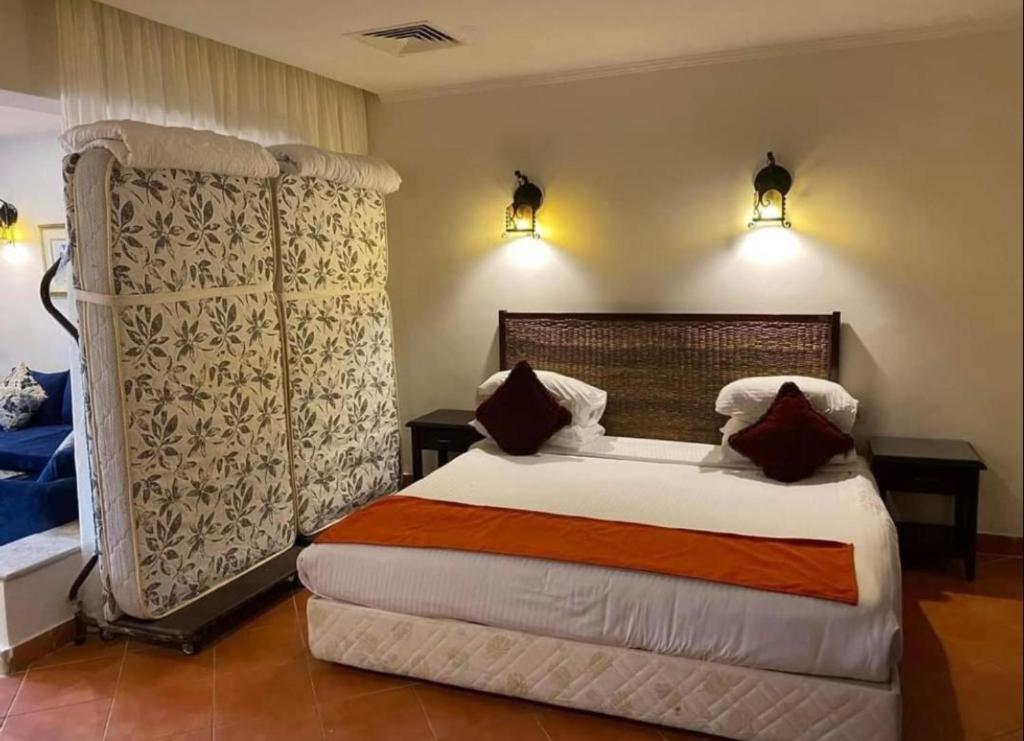 En eller flere senger på et rom på Porto Marina Patio Suite - Egyptian Residents Only