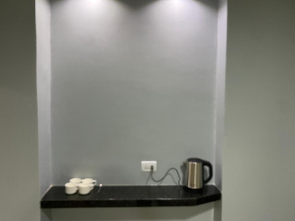 Příslušenství pro přípravu čaje a kávy v ubytování España Suites Hotel