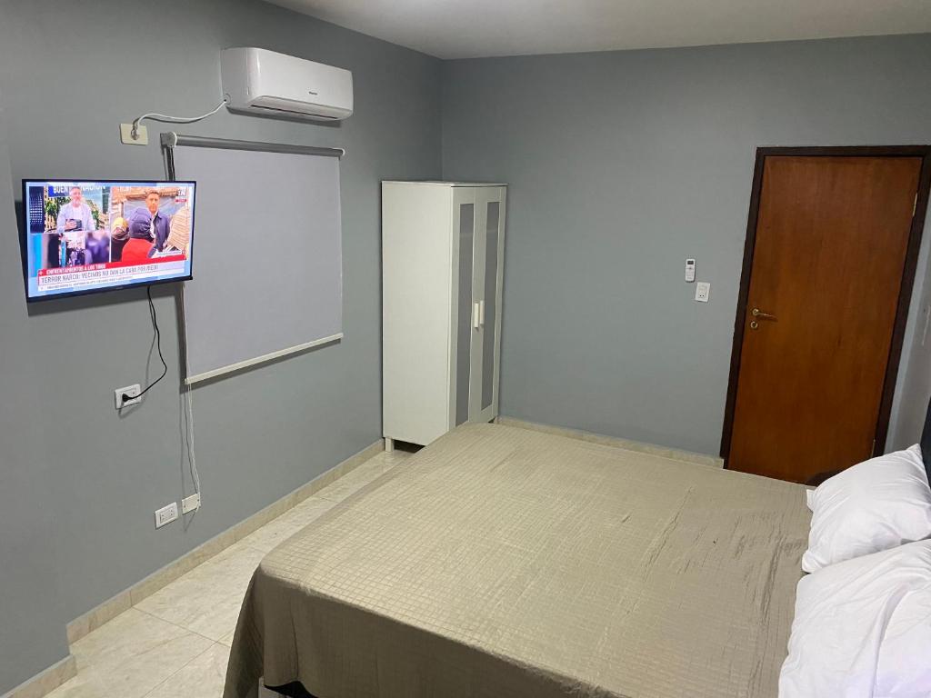 Postel nebo postele na pokoji v ubytování España Suites Hotel