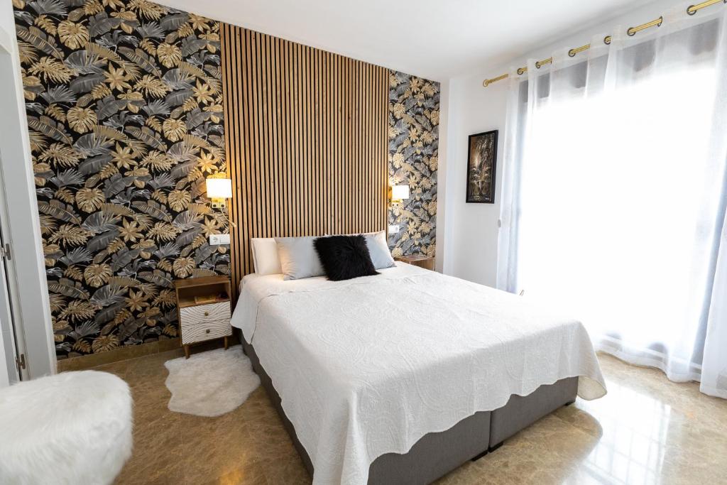 Łóżko lub łóżka w pokoju w obiekcie Penthouse in Estepona - Malaga