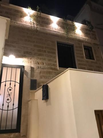 a building with a gate on the side of it at CASA ENRICA in Adelfia