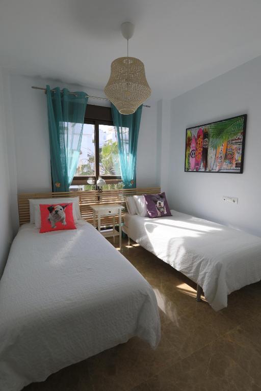 Łóżko lub łóżka w pokoju w obiekcie Penthouse in Estepona - Malaga