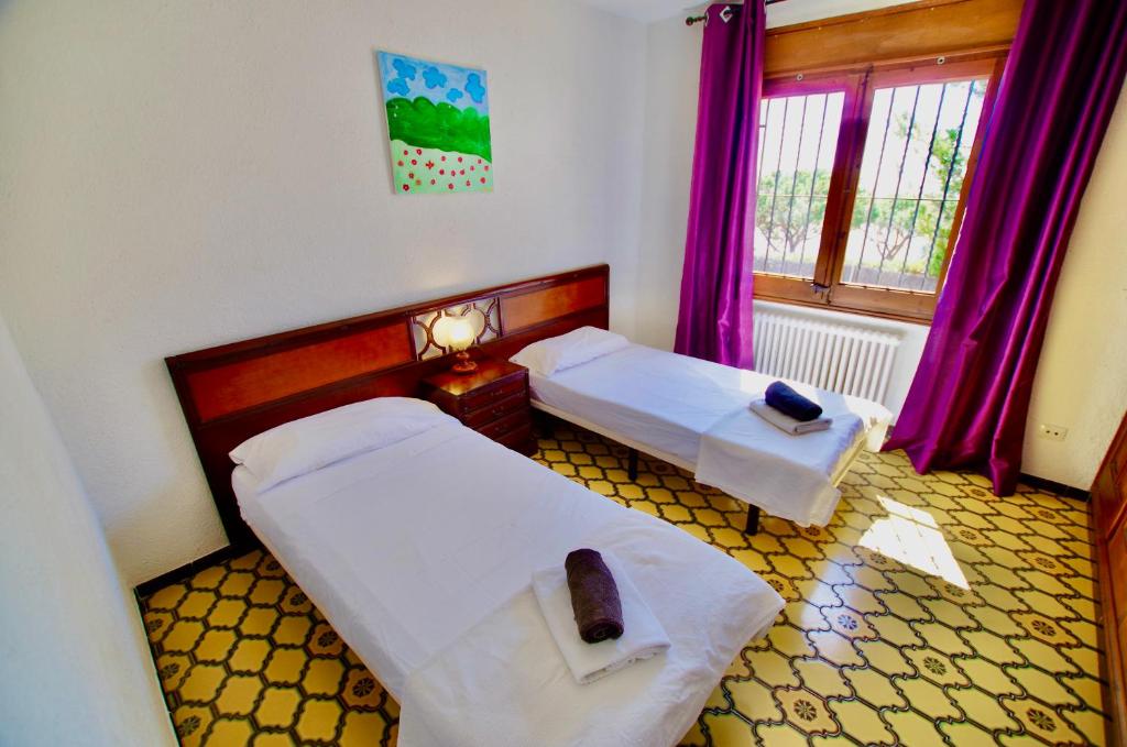 Posteľ alebo postele v izbe v ubytovaní V&V LLORET- VILLA MEDITERRANIA, vistas panorámicas al mar