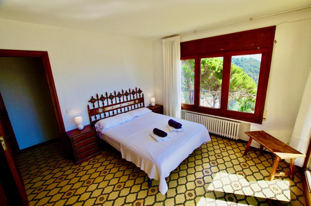 Posteľ alebo postele v izbe v ubytovaní V&V LLORET- VILLA MEDITERRANIA, vistas panorámicas al mar