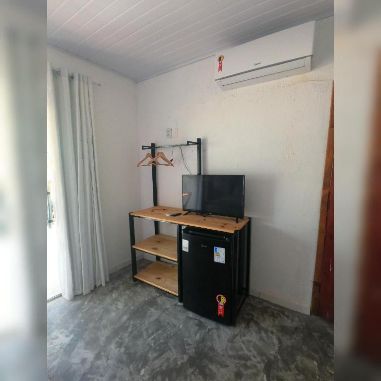TV a/nebo společenská místnost v ubytování Pousada Siriba
