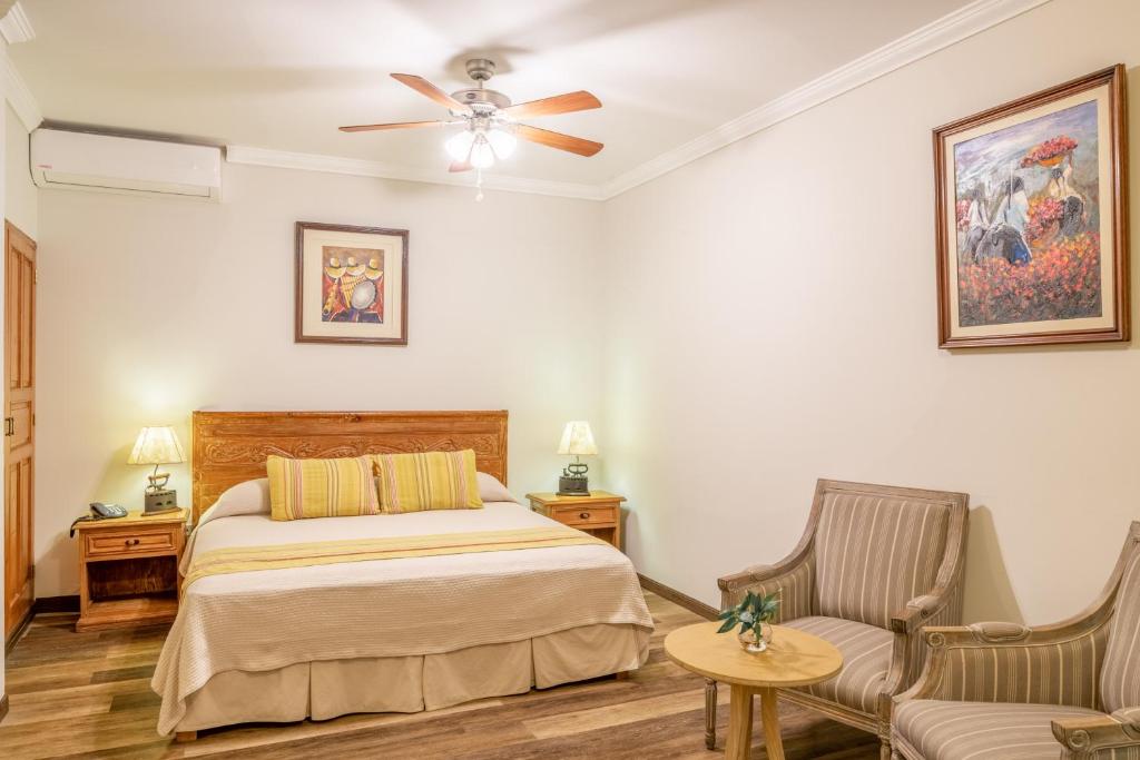 Postel nebo postele na pokoji v ubytování Hotel Antigua Miraflores