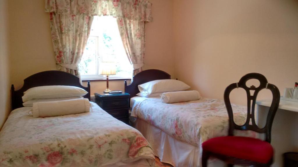 Postel nebo postele na pokoji v ubytování Corrib View Guesthouse h91rr72