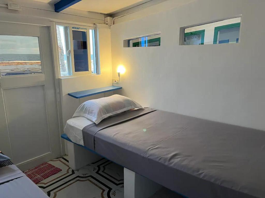 Katil atau katil-katil dalam bilik di Exclusive Beach Resort Rental - Baler