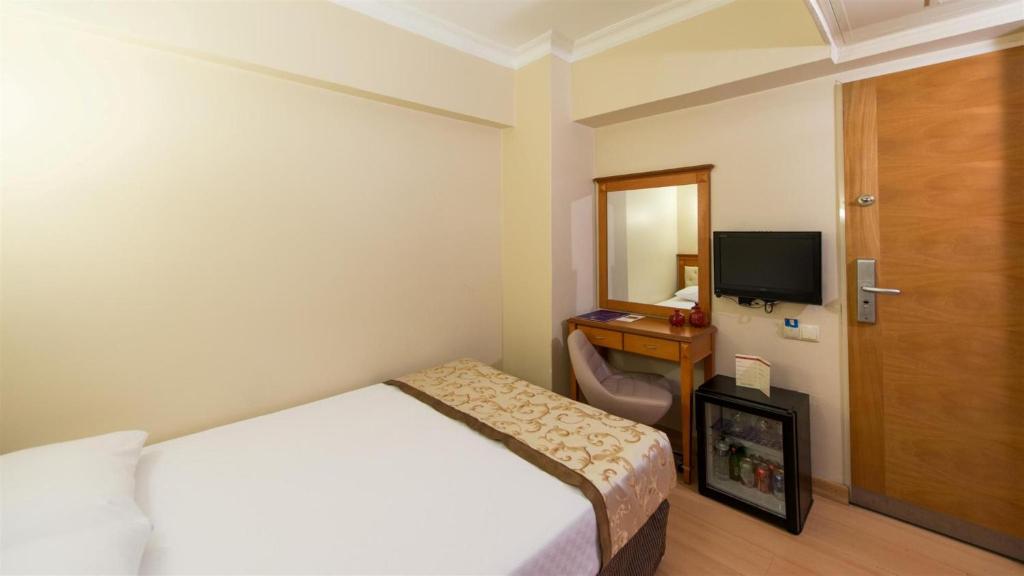 Postel nebo postele na pokoji v ubytování Prestige Hotel Old City