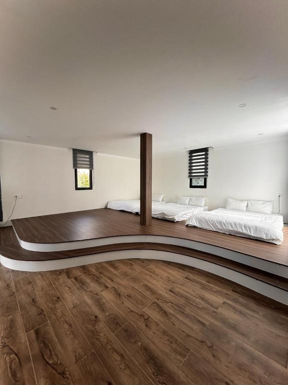 Postel nebo postele na pokoji v ubytování Memory Inn - Green Villa