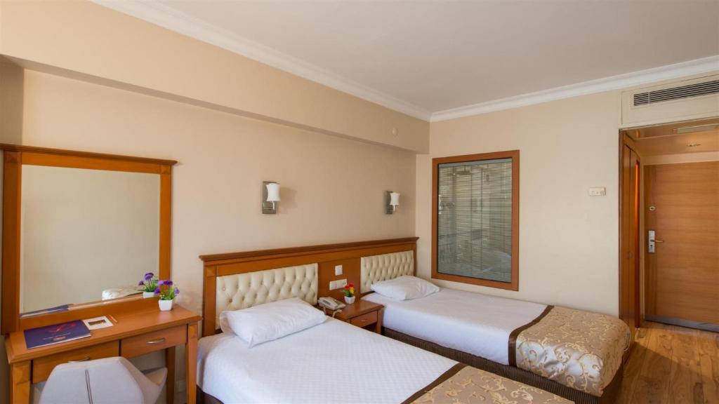 Postel nebo postele na pokoji v ubytování Prestige Hotel Old City