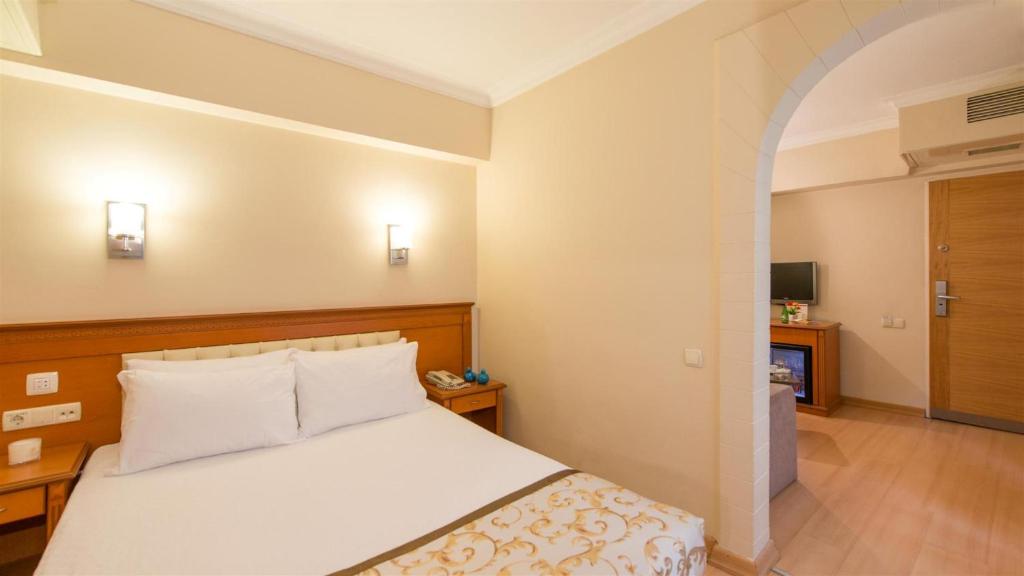 Postel nebo postele na pokoji v ubytování Prestige Hotel Old City