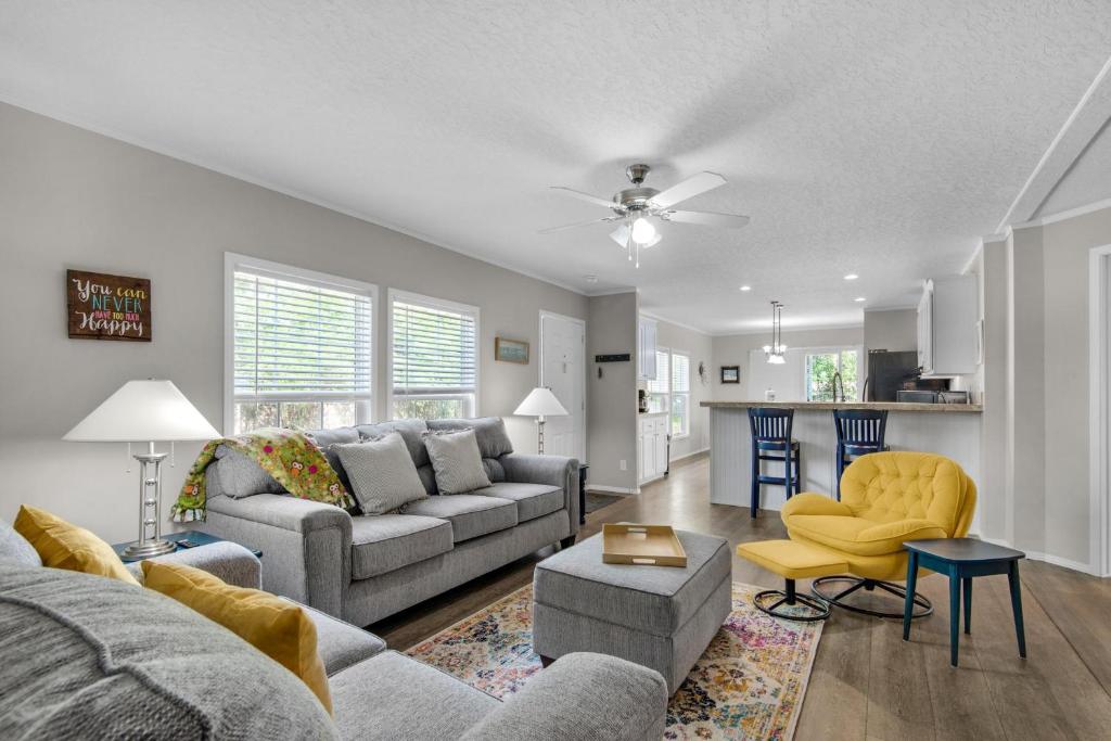 a living room with a couch and a table at Beachin' Fun in Navarre