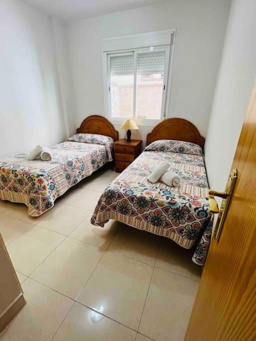 Postel nebo postele na pokoji v ubytování Apartamento Bella Bahía