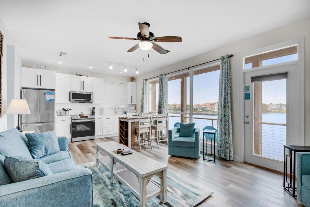 a living room with a couch and a ceiling fan at Destiny Beach Villas #15A in Destin