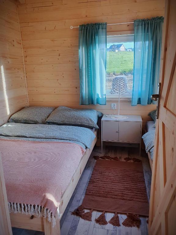Posteľ alebo postele v izbe v ubytovaní Domek Polna Cisza Bieszczady