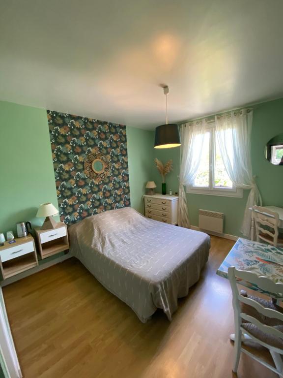 Postel nebo postele na pokoji v ubytování Moulin de Latouille