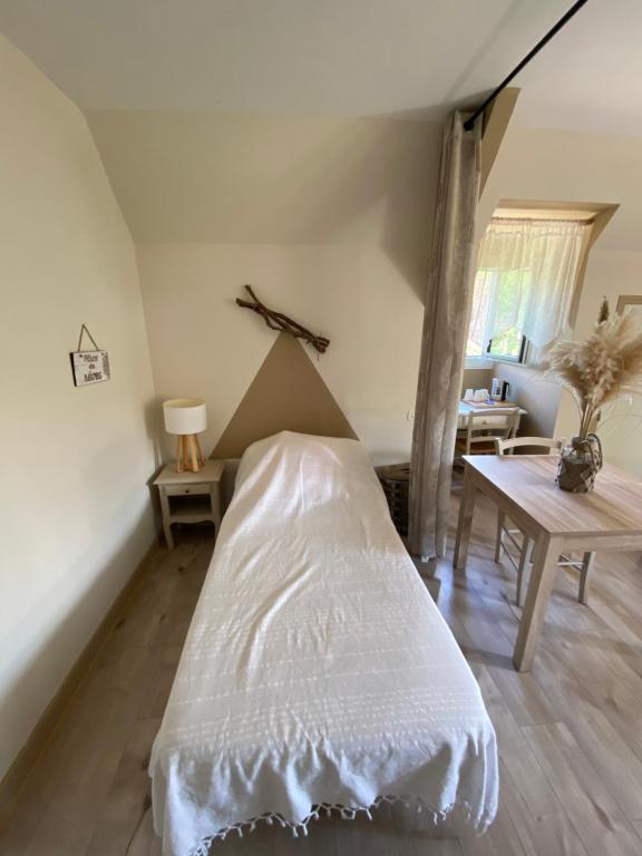 Postel nebo postele na pokoji v ubytování Moulin de Latouille