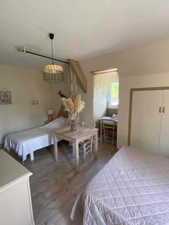 Postel nebo postele na pokoji v ubytování Moulin de Latouille