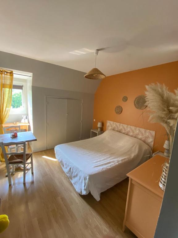 Postel nebo postele na pokoji v ubytování Moulin de Latouille