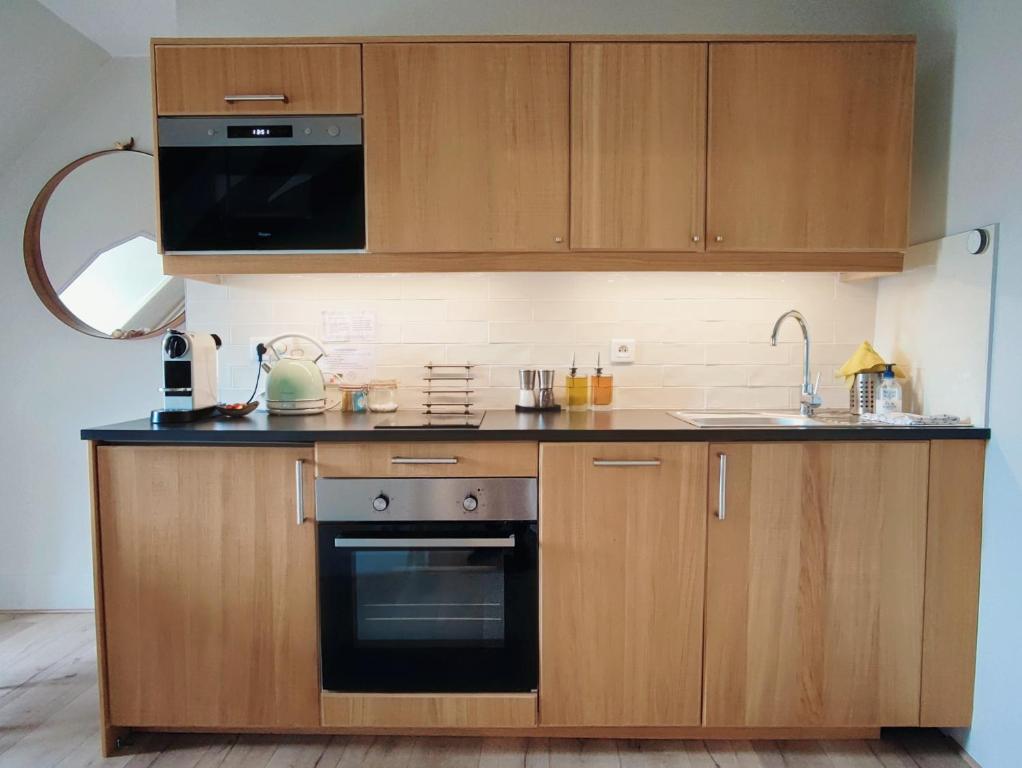 Kuchyň nebo kuchyňský kout v ubytování Les Suites - Saulieu