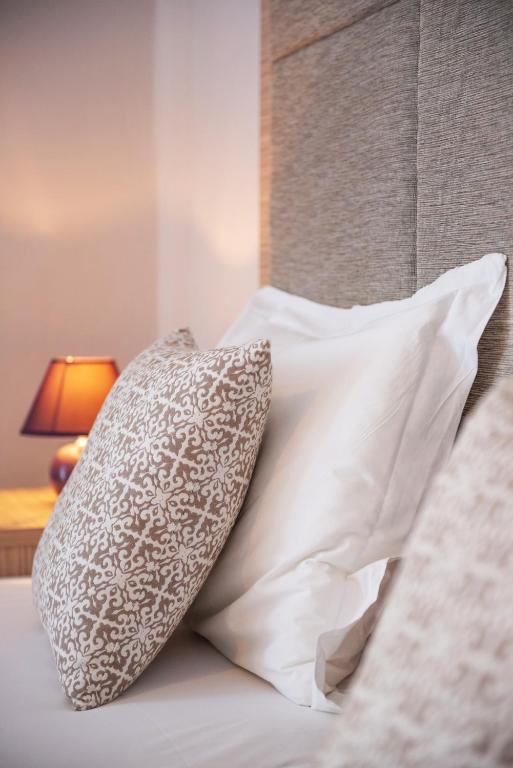 A bed or beds in a room at Christof Studios