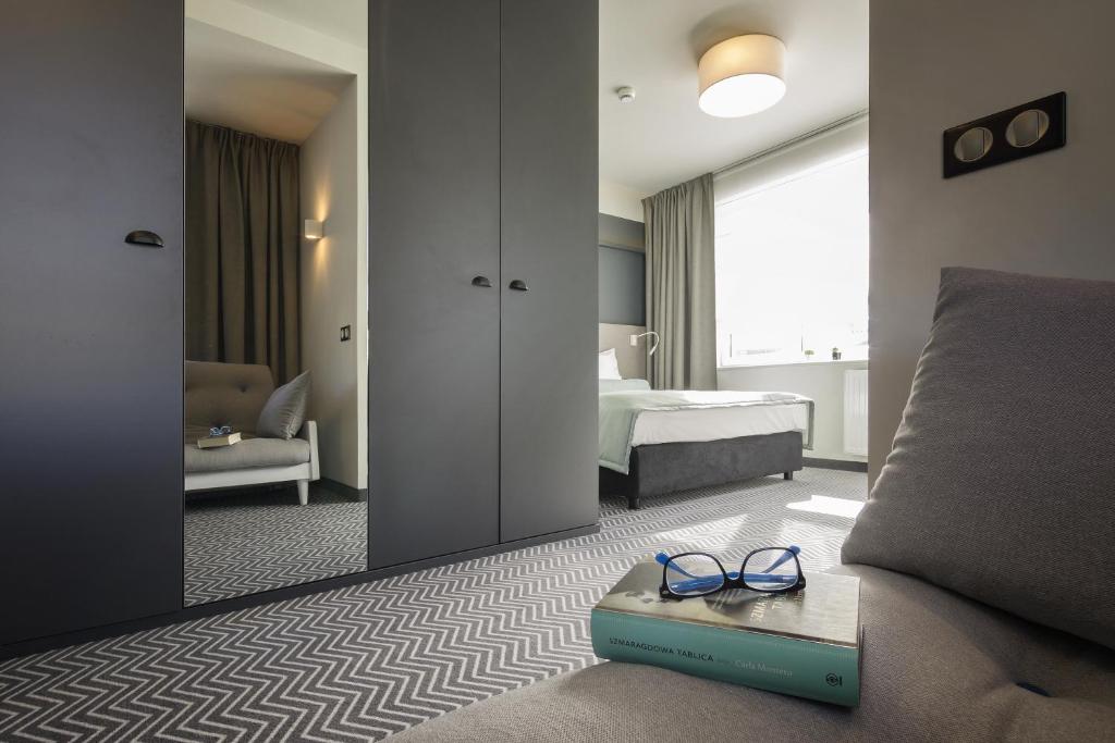 Postel nebo postele na pokoji v ubytování So Stay Hotel