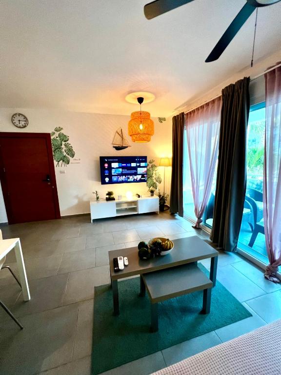 TV a/nebo společenská místnost v ubytování Apartment in Estrella, Dominicus-Bayahibe