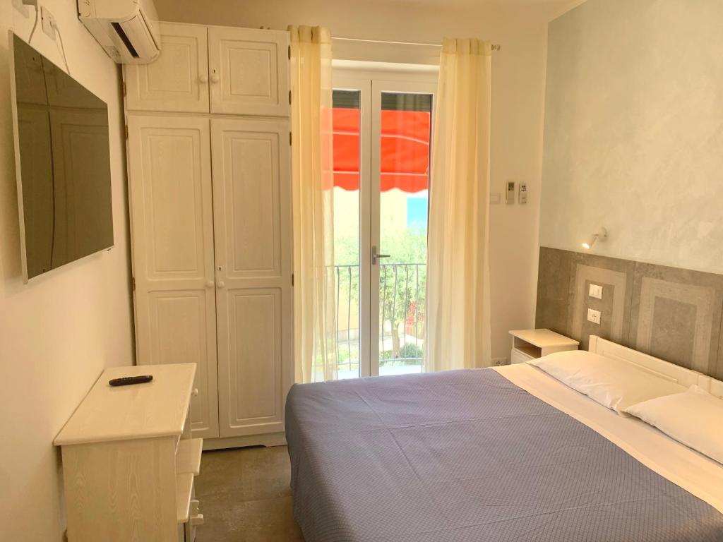 Postel nebo postele na pokoji v ubytování Hotel Marconi