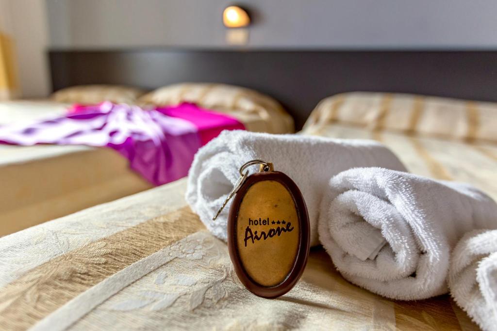 Postel nebo postele na pokoji v ubytování Hotel Airone
