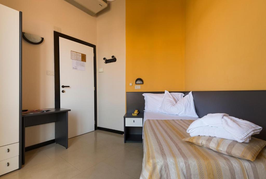 Postel nebo postele na pokoji v ubytování Hotel Airone