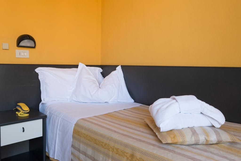 Postel nebo postele na pokoji v ubytování Hotel Airone