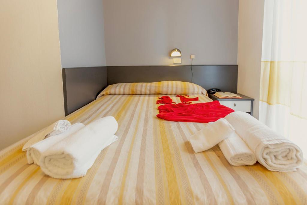 Postel nebo postele na pokoji v ubytování Hotel Airone