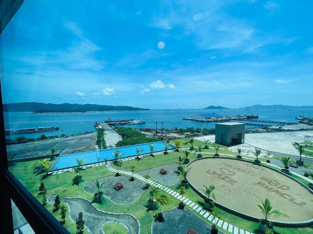 a view of the ocean from a hotel window at JQ1 SEA & POOL or CITY View WIFI I WASHING MACHINE for Seaview unit I CUCKOO WATER Jesselton Quay by R2 in Kota Kinabalu