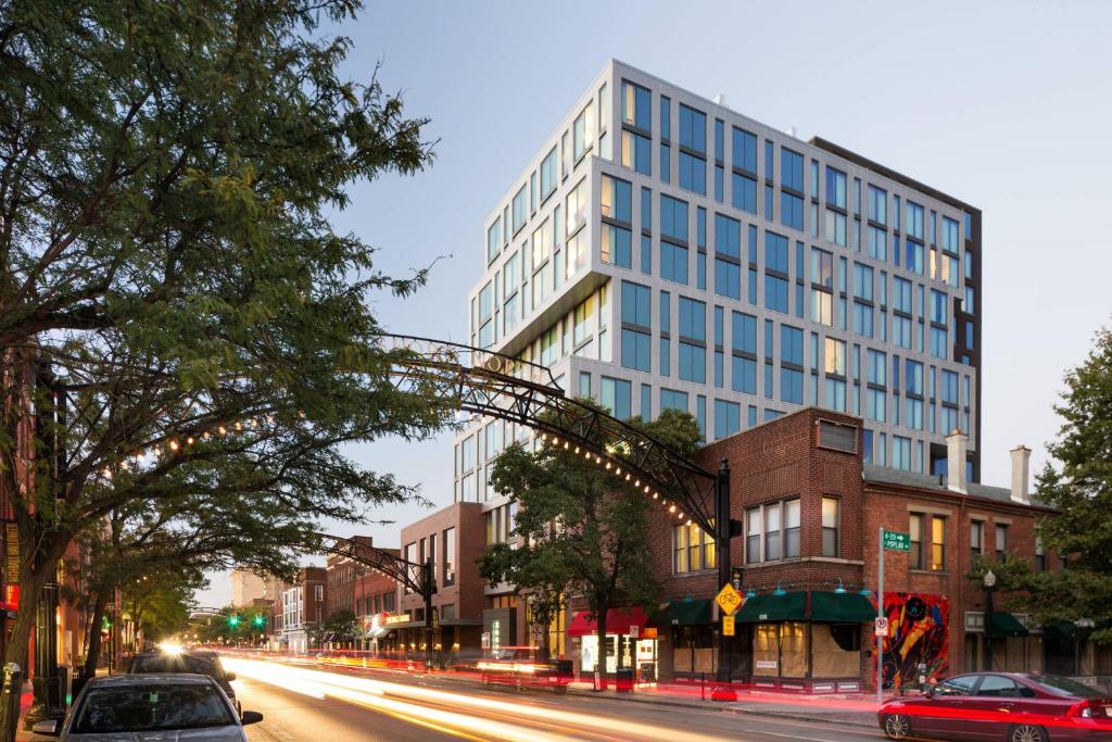 a tall building on a city street with cars at Le Meridien Columbus, The Joseph in Columbus