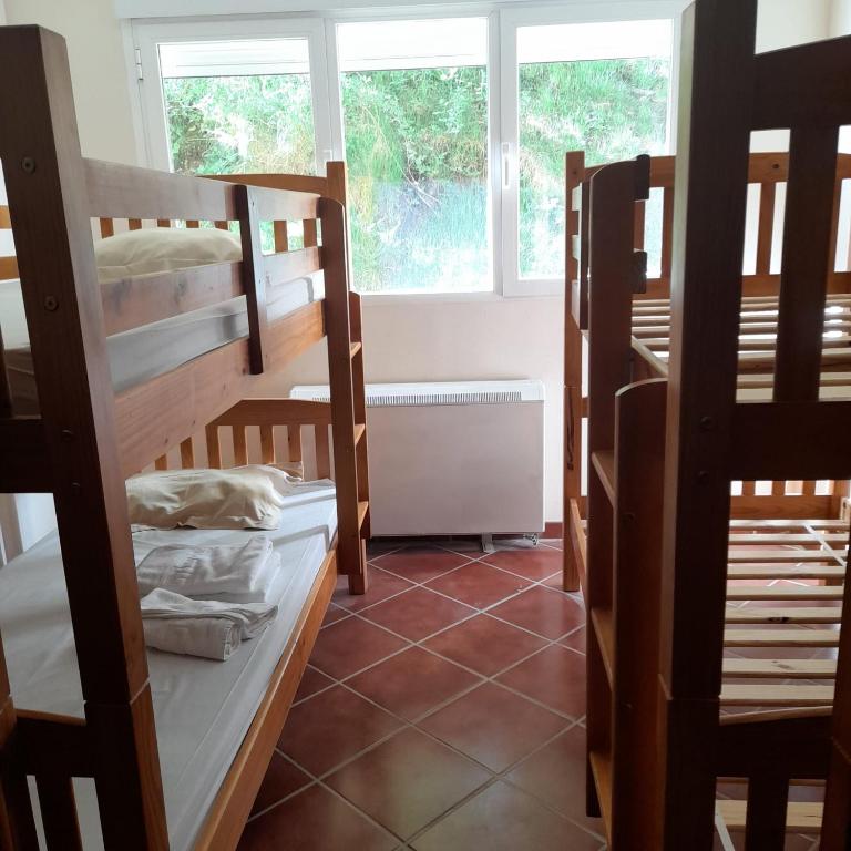 Postel nebo postele na pokoji v ubytování Albergue La Pinilla