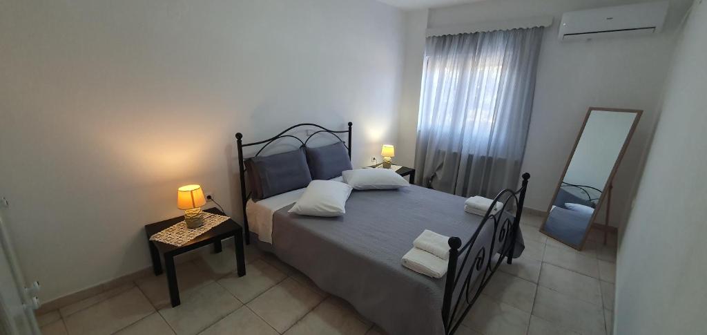 Posteľ alebo postele v izbe v ubytovaní Ailamakis Apartements