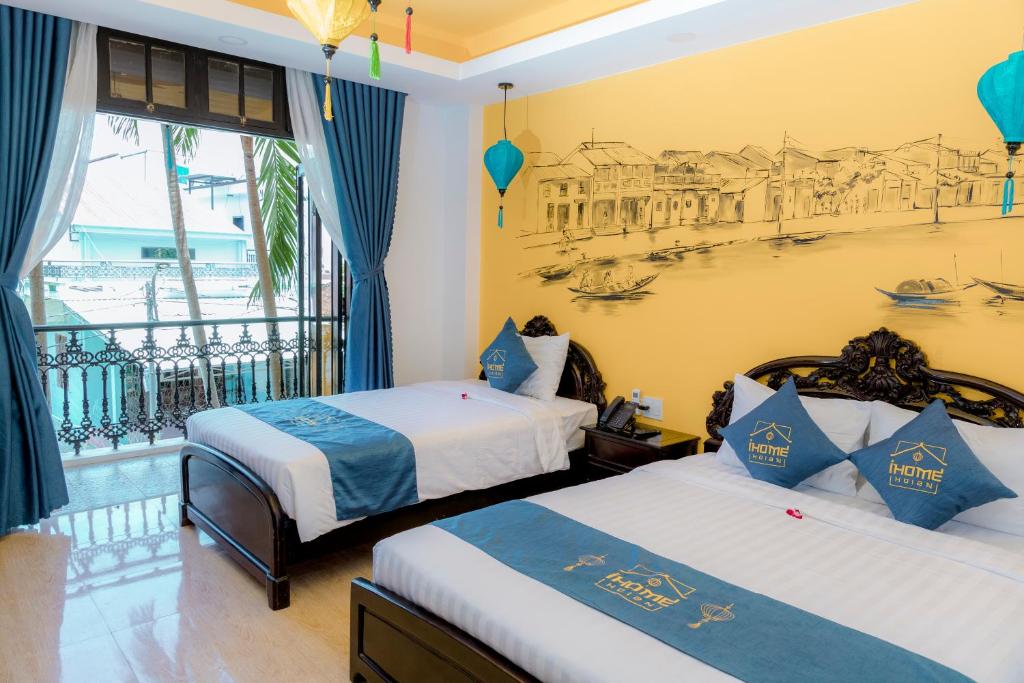 Giường trong phòng chung tại iHome Hoi An
