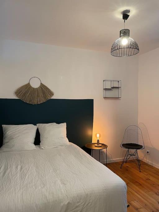 Posteľ alebo postele v izbe v ubytovaní Appartement en Centre-Ville