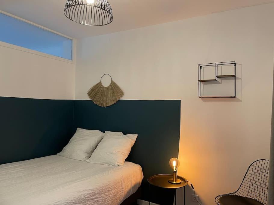 Posteľ alebo postele v izbe v ubytovaní Appartement en Centre-Ville