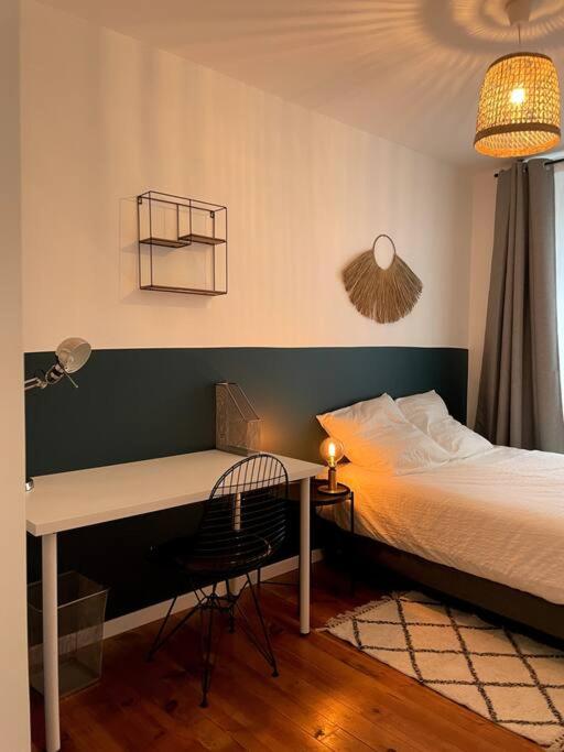 Posteľ alebo postele v izbe v ubytovaní Appartement en Centre-Ville