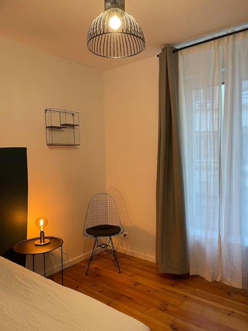 Posteľ alebo postele v izbe v ubytovaní Appartement en Centre-Ville