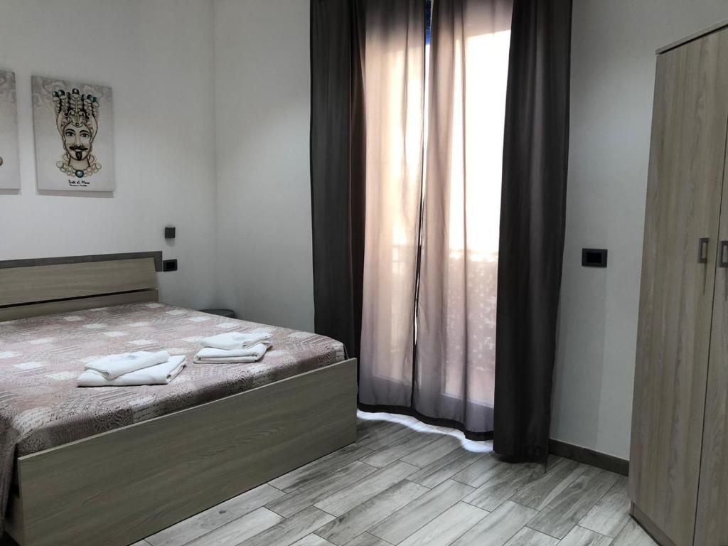 Łóżko lub łóżka w pokoju w obiekcie Sunrise Beach Apartment Trapani
