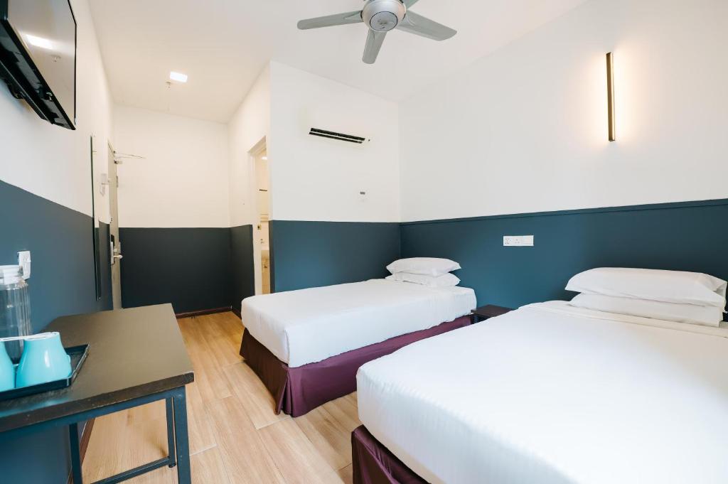 Postel nebo postele na pokoji v ubytování The Concept Hotel KL - Batu Caves