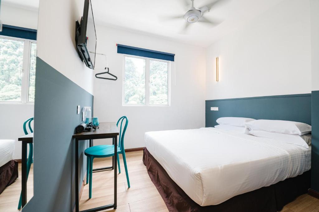 Postel nebo postele na pokoji v ubytování The Concept Hotel KL - Batu Caves