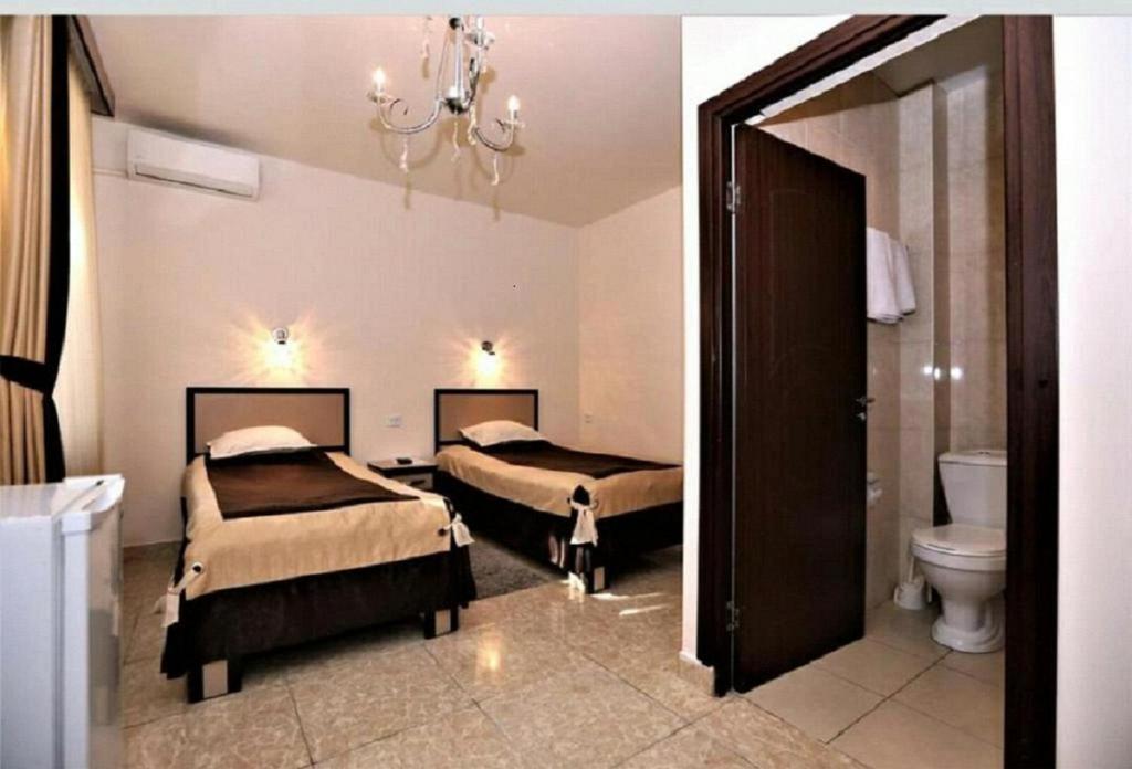 Postel nebo postele na pokoji v ubytování Comfort House Hotel