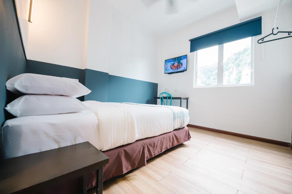 Postel nebo postele na pokoji v ubytování The Concept Hotel KL - Batu Caves