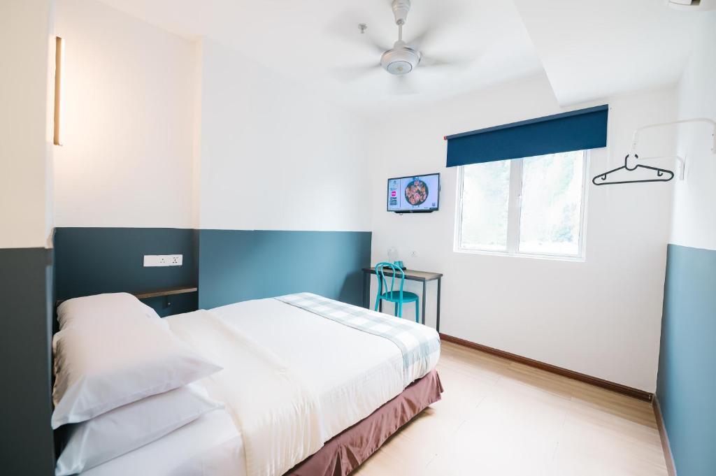 Postel nebo postele na pokoji v ubytování The Concept Hotel KL - Batu Caves