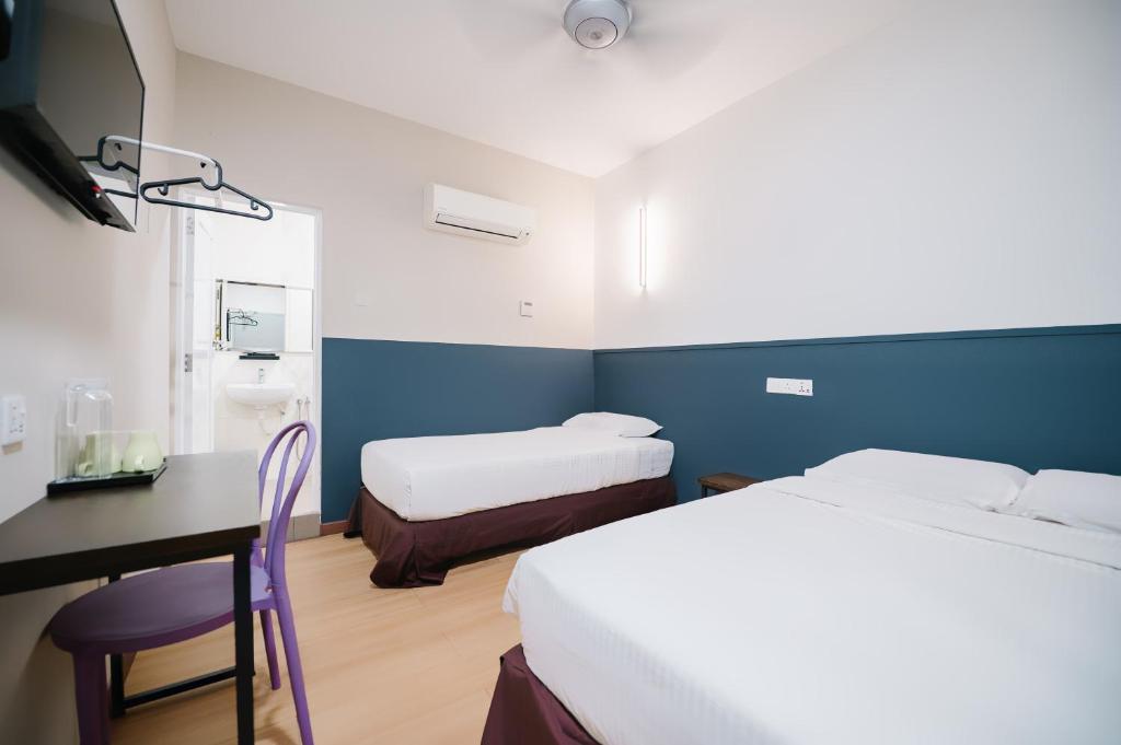 Postel nebo postele na pokoji v ubytování The Concept Hotel KL - Batu Caves