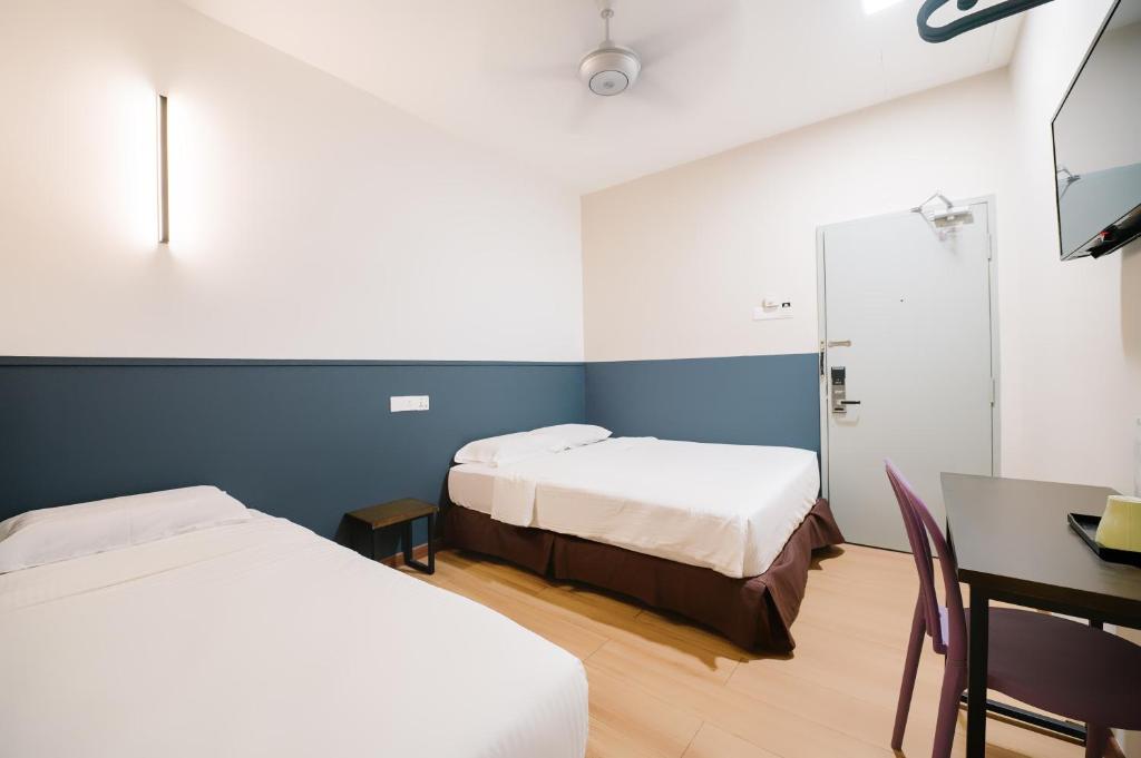 Postel nebo postele na pokoji v ubytování The Concept Hotel KL - Batu Caves